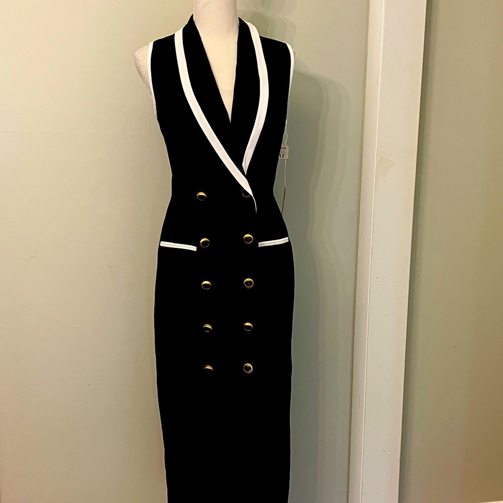 Stunning black and white trimmed double breasted sleeveless dress!